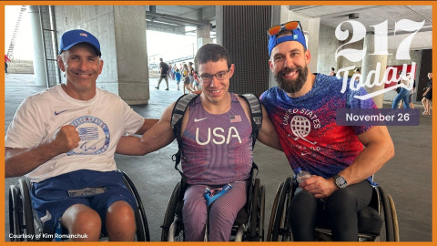 Daniel Romanchuk (middle) poses for a photo with his coaches from the University of Illinois Urbana-Champaign: Adam Bleakney (left) and Joey Peters (right). 