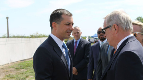 US Secretary of Transportation Pete Buttigieg talks with US Senator Dick Durbin (D-IL) during a stop to promote infrastructure investment in Savoy on July 31, 2023.