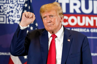 Former President Donald Trump did not sign Illinois’ loyalty oath when filing his nomination papers to run in Illinois in 2024. The oath, which is not mandatory, pledges he will not advocate for the overthrow of the government. Here, Trump gestures after speaking at a campaign rally at Terrace View Event Center in Sioux Center, Iowa, Friday, Jan. 5, 2024.