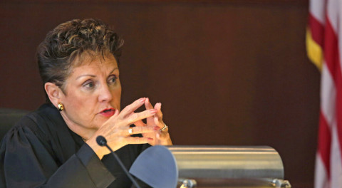 Illinois Supreme Court justice Rita R. Garman questions an attorney during oral arguments at the Michael A. Bilandic Building Tuesday, Sept. 10, 2013, in Chicago.