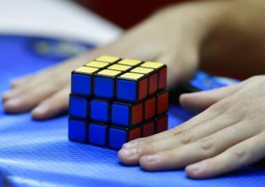 A player finished a Rubik's Magic Cube at the international game fair 'SPIEL' in Essen, Germany, Thursday, Oct. 26, 2017. Around 1100 exhibitors from around 50 nations attend the annual four-day game fair.