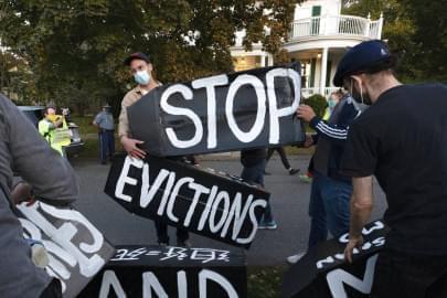 In this Oct. 14, 2020, file photo, housing activists erect a sign in Swampscott, Mass. A federal freeze on most evictions is set to expire soon. The moratorium, put in place by the Centers for Disease Control and Prevention in September, was the only tool keeping millions of tenants in their homes.