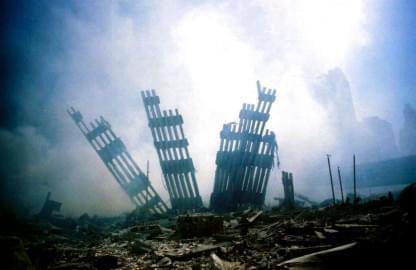 The remains of the World Trade Center stands amid the debris in New York, Tuesday, Sept. 11, 2001.