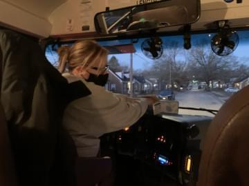 Amber Shelhorn drives students to Riverdahl Elementary in Rockford. She's normally a supervisor in the transportation department, but is driving a bus because of a driver shortage in the district. 