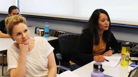Unit 4's International Prep Academy teachers Christina Cañas (left) and Abby Heras attend a workshop on Asian American children's books on Aug. 1, 2023 at the University of Illinois College of Education in Champaign.