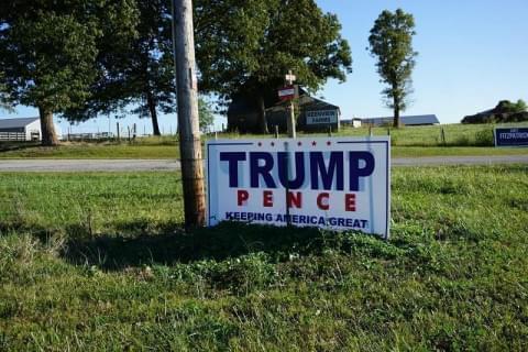 A Trump - Pence sign in rural Missouri, an area where President Trump won overwhelmingly in 2016. Now farmers are analyzing his farm policy and that of his oppoent, Joe Biden, in advance of the Nov. 3 election.