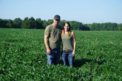 Matt and Kate Lambert in their soybean field in northern Missouri. They are participating in a research study to find out how much carbon their farming practices are keeping in the ground and out of the atmosphere.