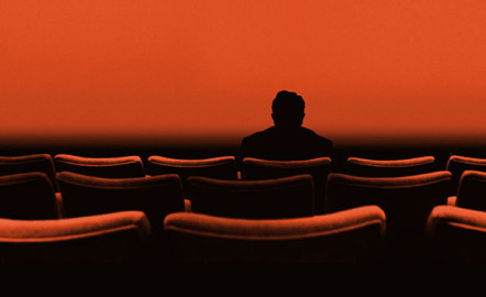Man sitting in movie theater
