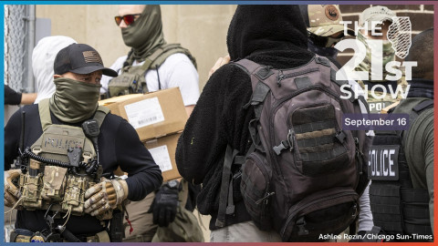 U.S. Immigration and Customs Enforcement agents escort someone inside the agency’s processing center in Broadview as protesters yell and chant “quit your job” and “shame on you” on Sept. 5