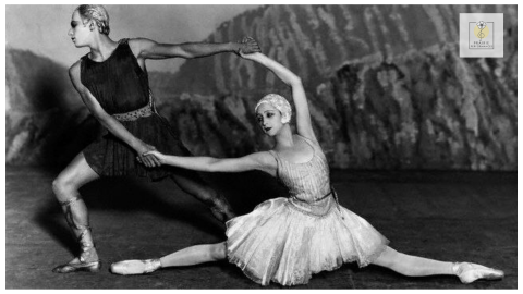 A scene from Stravinsky's ballet, Apollo, featuring two dancers positioned in geometric poses.