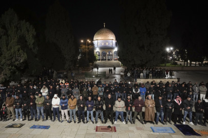 Muslim worshippers perform "tarawih," an extra lengthy prayer held during the Muslim holy month of Ramadan, next to the Dome of Rock at the Al-Aqsa Mosque compound in the Old City of Jerusalem, Sunday, March 10, 2024. Officials in Saudi Arabia have declared the start of the fasting month of Ramadan after sighting the crescent moon Sunday night. The announcement marks the beginning of Ramadan for many of the world's 1.8 billion Muslims.