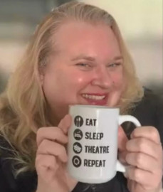 Julia Schade showing off a mug that her father gave her.