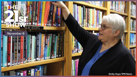 Vickie Pierce, Circulation Clerk at Greenup Township Public Library in Greenup, Illinois arranges books.