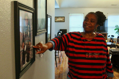 Yvonne Miller of Champaign points to a portrait of one of her grandchildren that she displays in her home. It’s one of two children of her son, Christopher Kelly, who died by gun violence. Christopher had two children: four-year-old Ca’Nylah Kelly and 1-year-old Christopher Kelly Jr., who was born after Christopher’s death.