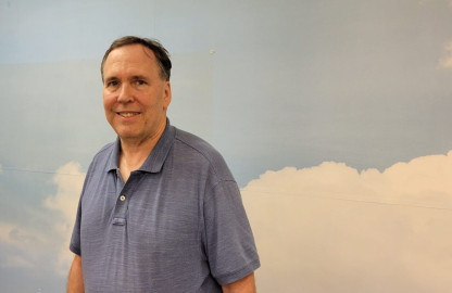 Ed Kieser, during a recent visit to the office that once held the WILL Weather Department. Kieser was WILL's staff meteorologist from 1987 to 2010. 