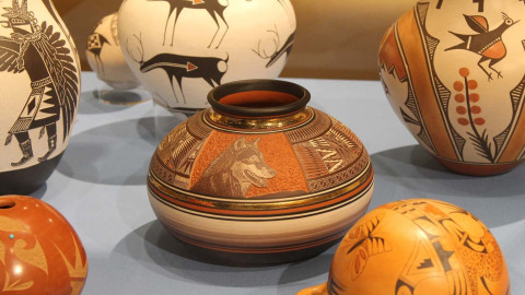The University of Illinois Spurlock Museum now has a policy of only displaying Indigenous artwork purchased or loaned from known creators. Navajo artist Elmay Dawes created this pot (center) in 1995.