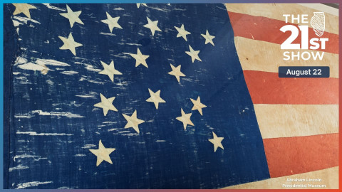 tattered fabric has 21 white stars on a blue field, plus red and white stripes