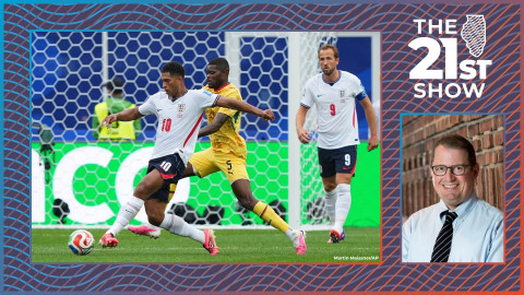 a soccer player in a white jersey stretches to get the ball away from a player in a yellow kit — both are wearing bright pink cleats, which is a distinct trend at the 2026 World Cup