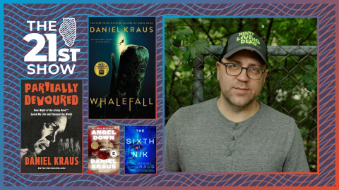 Daniel Kraus is seen wearing a T-shirt with three buttons, as well as a baseball hat with 