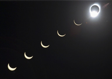 The progression of a total solar eclipse is seen in a multiple exposure photograph taken in 5-minute intervals, with the moon passing in front of the sun above Siem Reap in northwestern Cambodia, 225 kilometers (140 miles) from Phnom Penh, on Tuesday, Oct. 24, 1995. 