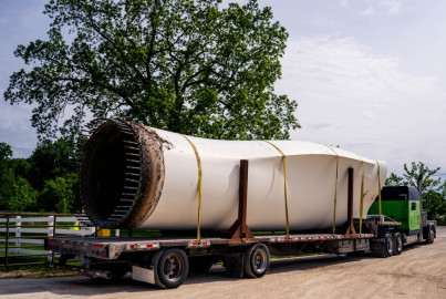 A deconstructed wind turbine blade sits on a tractor-trailer after it is weighed on Monday at Veolia Environmental Services in Louisiana, Missouri. The company has expanded the plant's services in order to recycle the blades from across the United States.