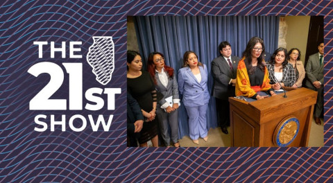 woman speaking at podium surrounded by other lawmakers