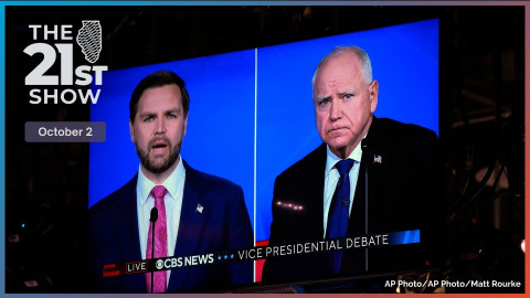 As seen on a monitor in the studio Republican vice presidential nominee Sen. JD Vance, R-Ohio, and Democratic vice presidential candidate Minnesota Gov. Tim Walz participate during a vice presidential debate hosted by CBS News, Tuesday, Oct. 1, 2024, in New York. 