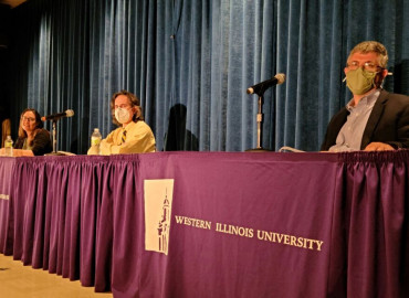 Betsy Perabo, Richard Filipink, and Greg Baldi (from left to right) shortly before a panel discussion on the Russian invasion of Ukraine began in Macomb.