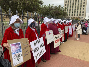 Illinois Handmaids protest abortion restrictions at a rally in downtown Springfield in 2021.
