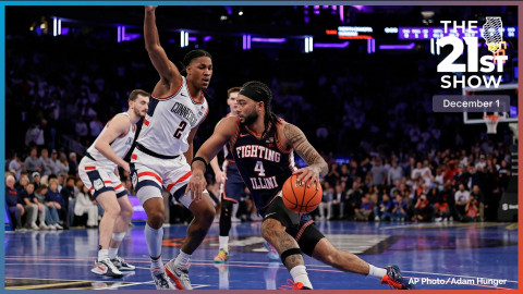  Illinois guard Kylan Boswell (4) drives to the basket past UConn guard Silas Demary Jr. (2) during the second half of an NCAA college basketball game Friday, Nov. 28, 2025, in New York.