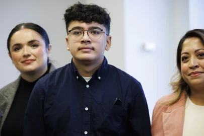From left to right, Maralea Negron, Director of policy, advocacy, and research at the The Network, Manny Alvarez, Karina Gonzalez’s son, and State Senator Celina Villanueva take a photo after a press conference in support of Karina’s Bill in 2023. The legislation, which would strengthen state law to protect domestic violence survivors from firearms, was not called for a vote in the just-completed legislative session.