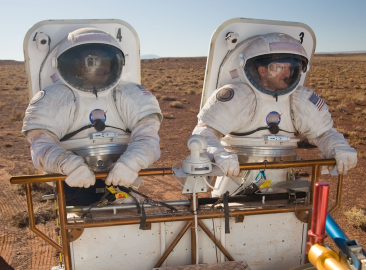 A simulation of two astronauts walking on Mars. 