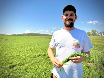 Scott Thellman grows a mix of organic produce and conventional crops on land adjacent to a planned utility-scale solar farm north of Lawrence, Kansas. He says the project would take good farmland out of production.