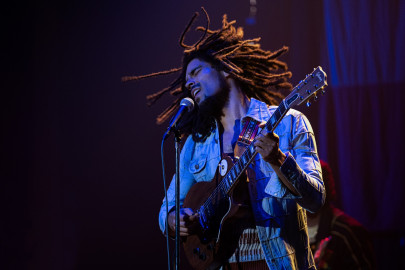 Kingsley Ben-Adiar performing on stage as Bob Marley