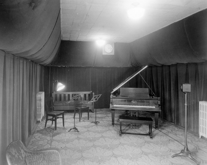piano and microphones in radio studio from 1930s