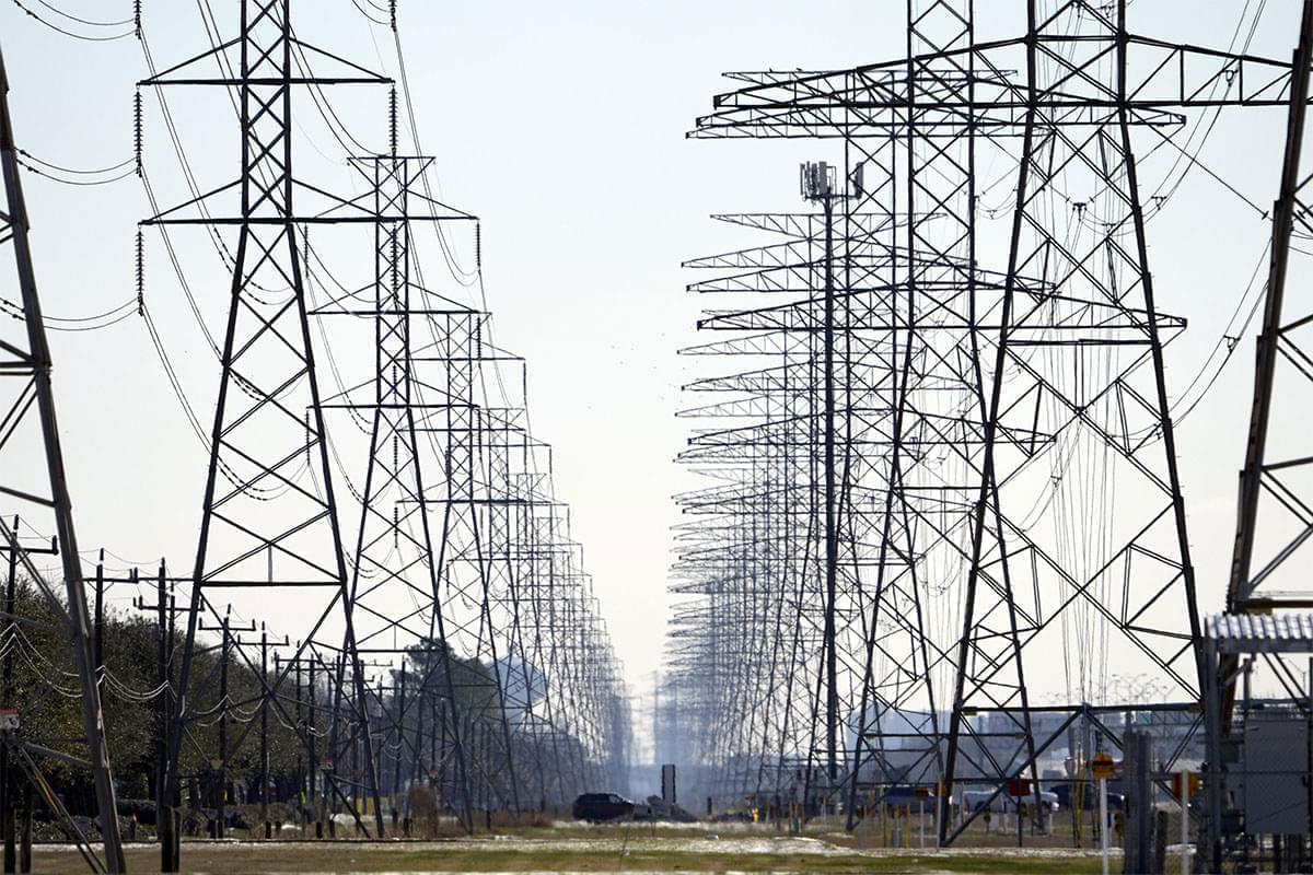Shown above are power lines in Houston. A Democratic senator is calling for federal investigations into possible price gouging of natural gas in the Midwest and other regions following severe winter storms that plunged Texas and other states into a deep freeze that caused power outages in million of homes and businesses.