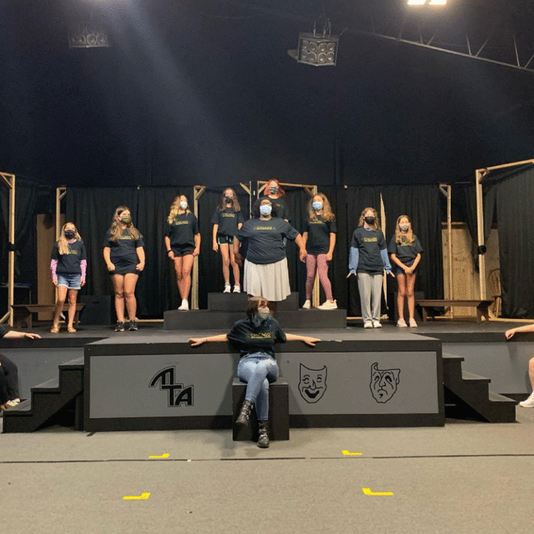 The cast of the Monticello Theatre Association's youth production "Chicago" rehearses in their theater. MTA's president, Dan Nowlin, says the whole cast and crew has stayed masked for all of the rehearsal process despite many on the staff being vaccinated.